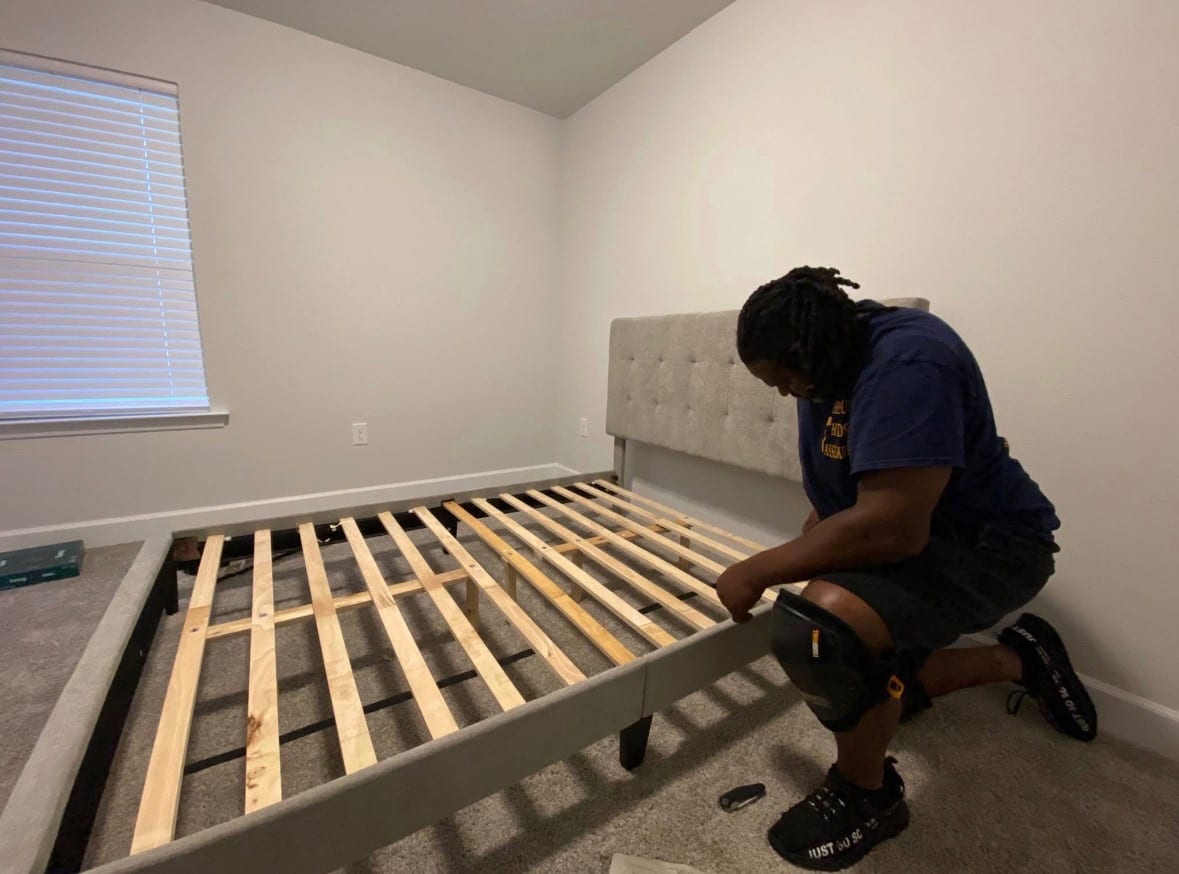 Reuben assembling an upholstered bed frame